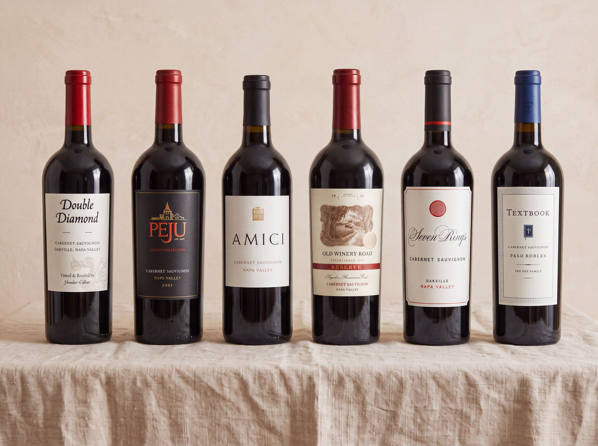 The Napa Cabernet Case — six Cabernets on a linen table