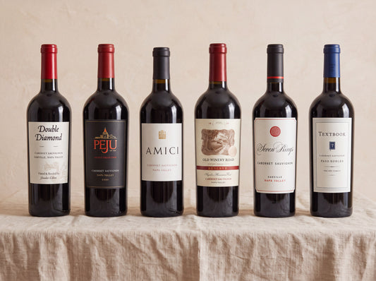 The Napa Cabernet Case — six Cabernets on a linen table