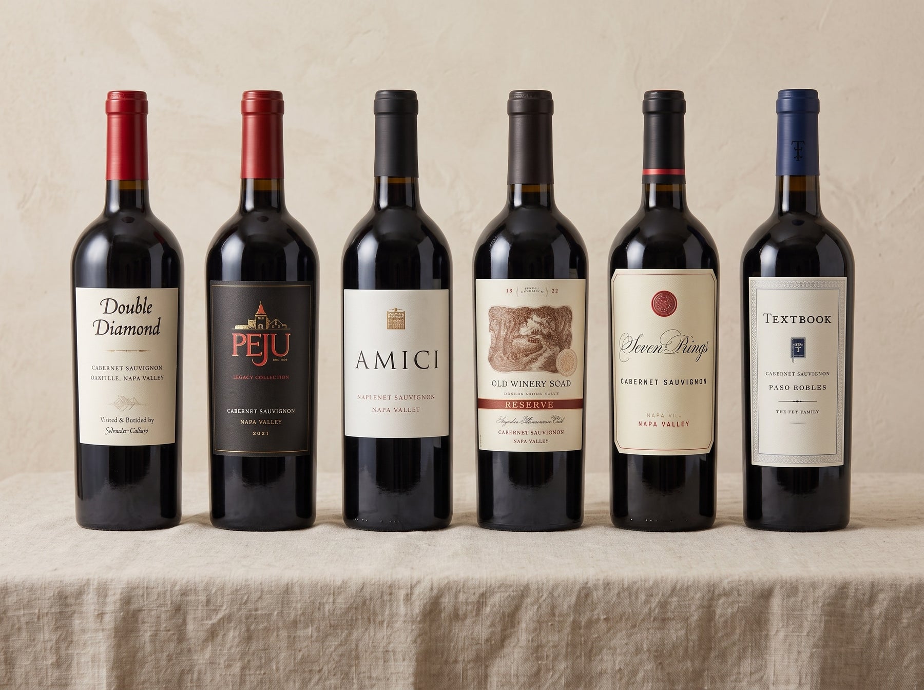 The Napa Cabernet Case — six Cabernets on a linen table