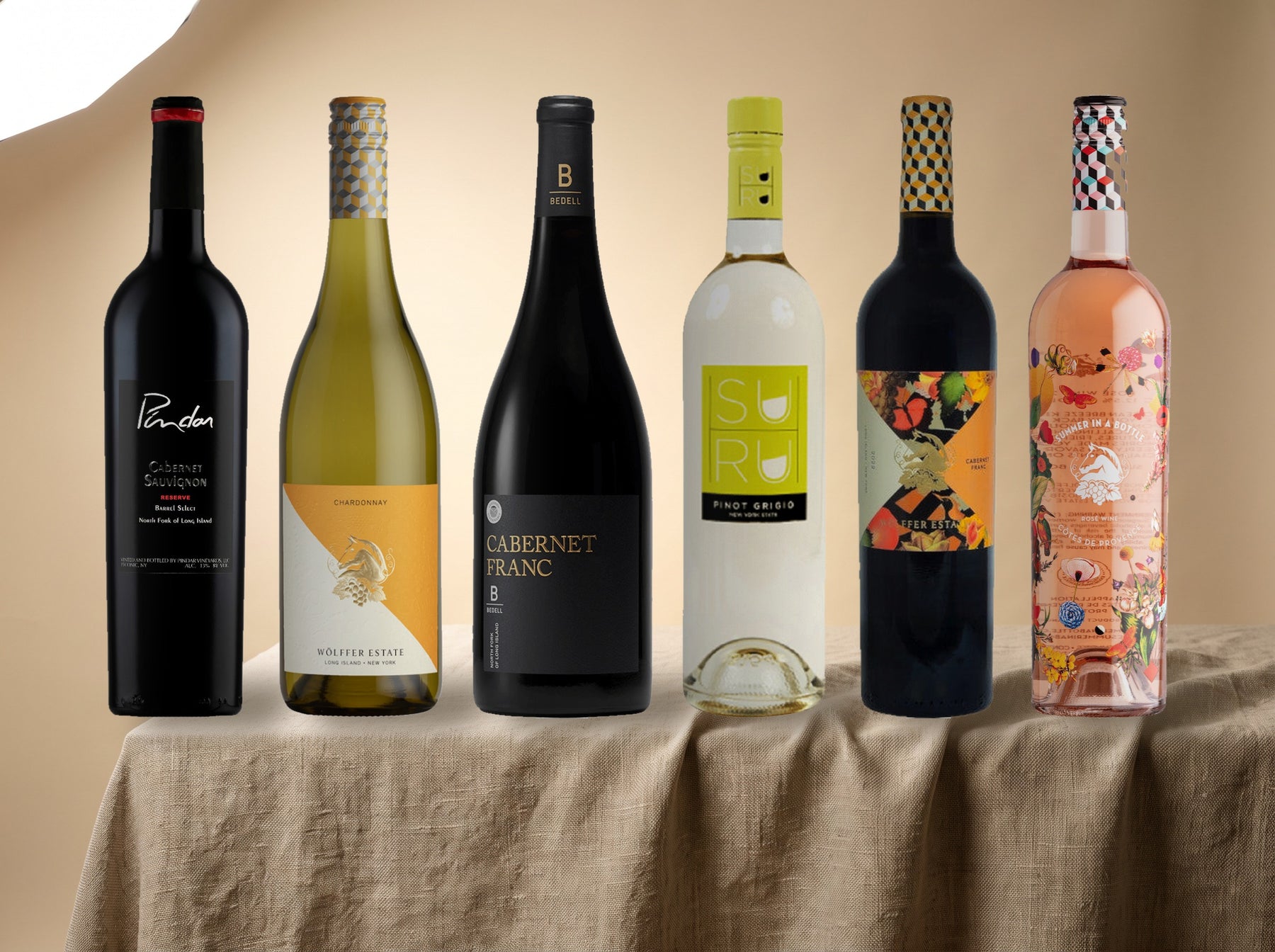 The New York Case — six still Long Island bottles on linen