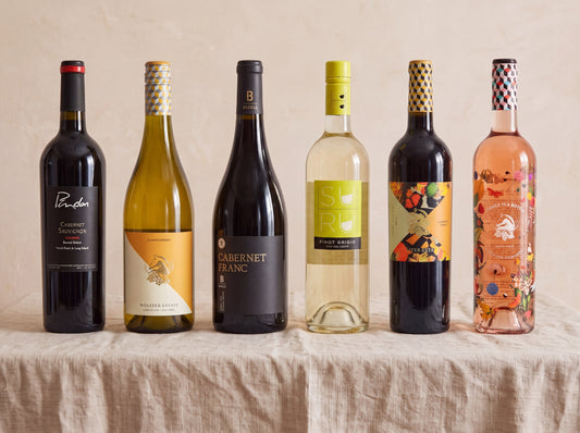 The New York Case — six still Long Island bottles on linen
