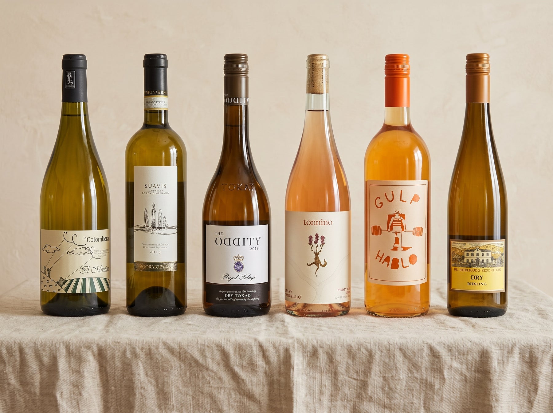 The Unique Whites Case — six rare white grapes on a linen table