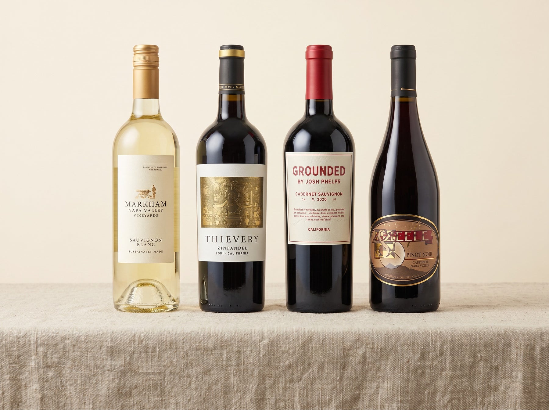 The four California wines in the case, photographed on linen