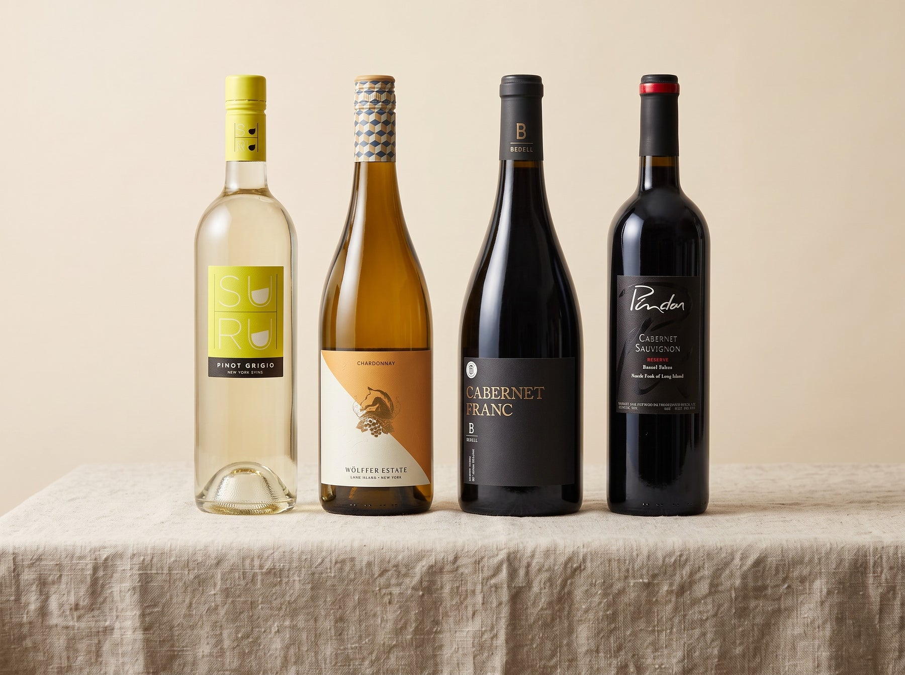 The four Long Island wines in the case, photographed on linen