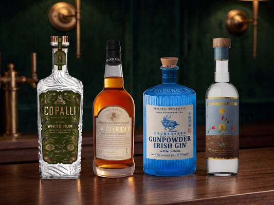 The Beginner Bar Kit: Copalli white rum, Rough Rider The Happy Warrior cask strength bourbon, Drumshanbo Gunpowder Irish gin and Zumbador tequila blanco on a bar